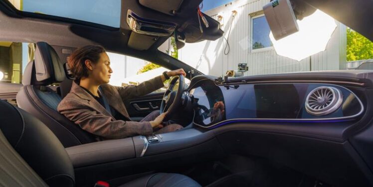 Woman driving her car and being distracted.